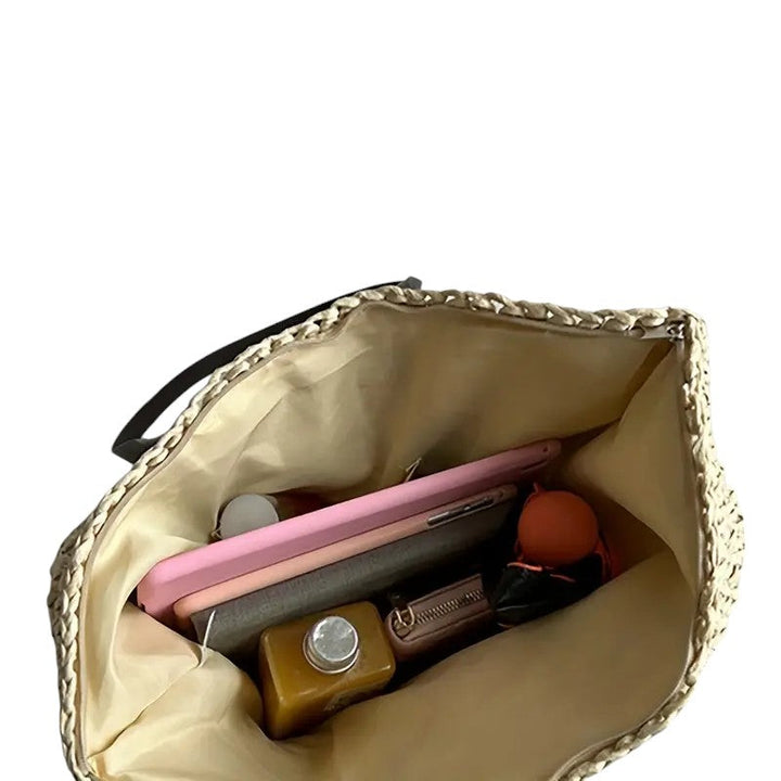 Borsa tote intrecciata Adele in diverse colorazioni affiancate, evidenziando le opzioni disponibili.