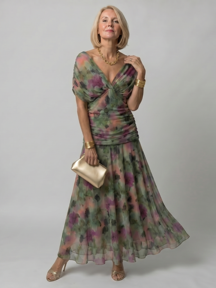 Abito midi a spalle scoperte Anthea in una fantasia multicolore, perfetto per l'estate.