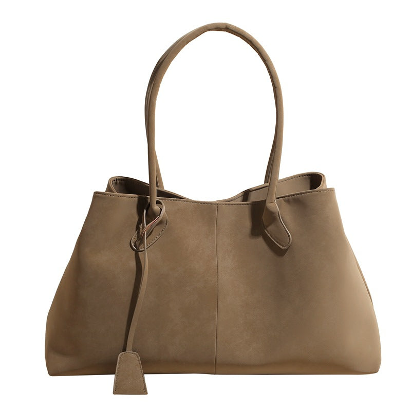 Vista frontale della borsa tote Arianna color crema, mostrando la sua forma elegante e pulita.