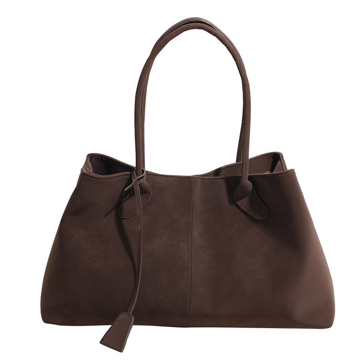 Dettaglio del logo o del marchio sulla borsa tote Arianna, se presente, in un'immagine ravvicinata.