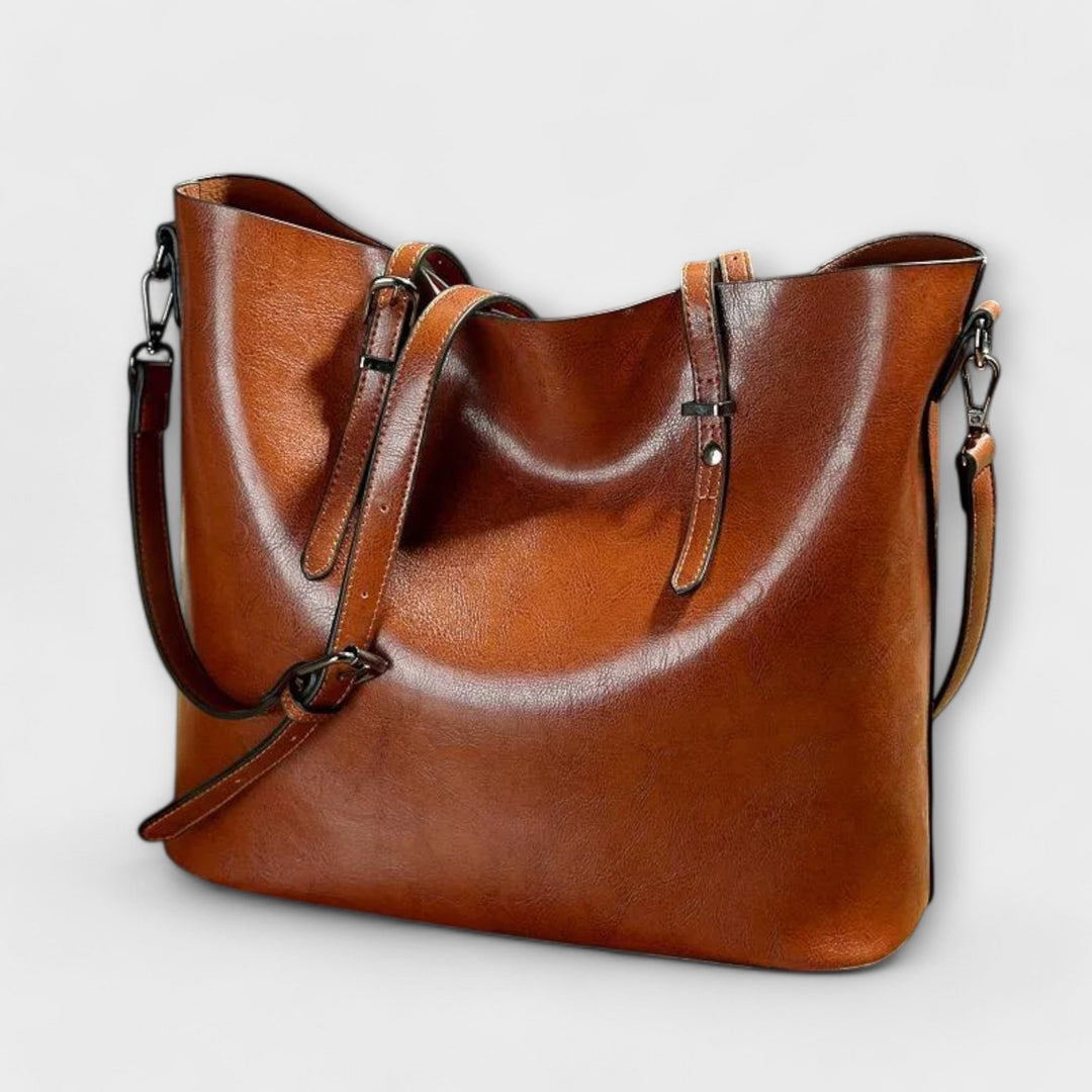 Borsa a spalla vintage Aurelia colore marrone, vista frontale con manici e tracolla.
