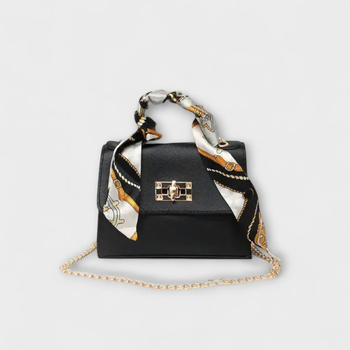 Borsa a spalla Eleonora in marrone chiaro con sciarpa decorativa su sfondo neutro, vista frontale.