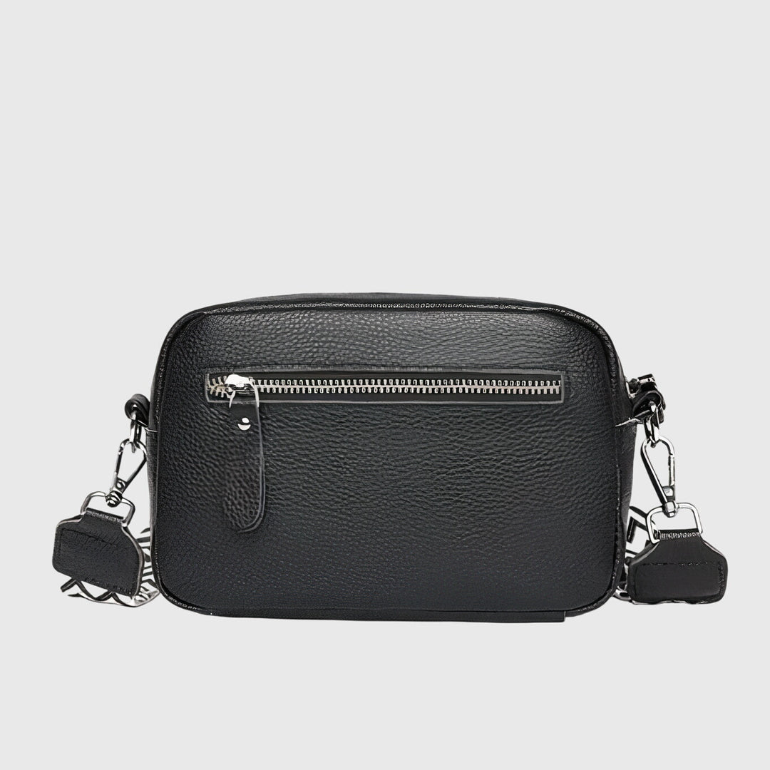 Borsa a tracolla Ella in pelle beige, angolazione laterale, mostrando la profondità e la struttura della borsa.