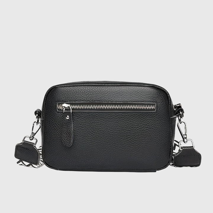Borsa a tracolla Ella in pelle beige, angolazione laterale, mostrando la profondità e la struttura della borsa.