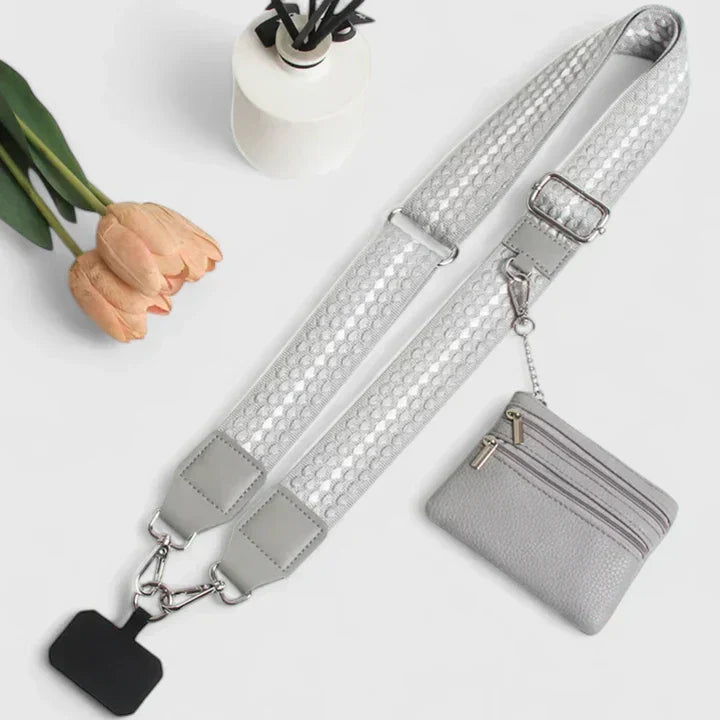 Borsa elegante Elodie nera, vista frontale su sfondo bianco, che mostra le cerniere e la tracolla.