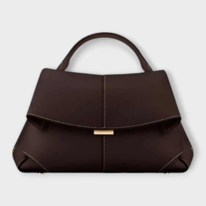 Borsa a tracolla di lusso nera, vista dall'alto, che rivela l'interno spazioso e i scomparti ben organizzati per gli essenziali.