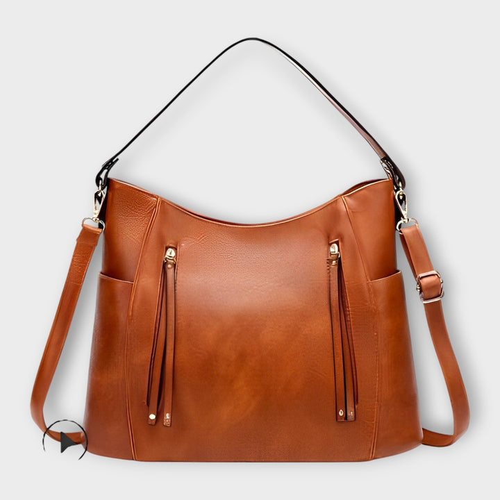 Borsa a mano elegante Ginevra color marrone, mostrata frontalmente con chiusura a scatto magnetica visibile.