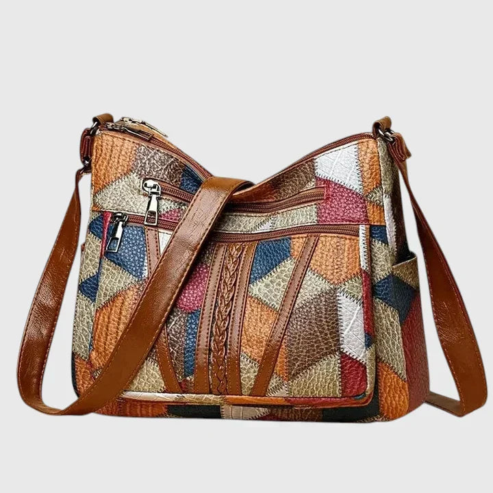 Borsa elegante Hadria marrone con design patchwork frontale, dettagli in pelle visibili