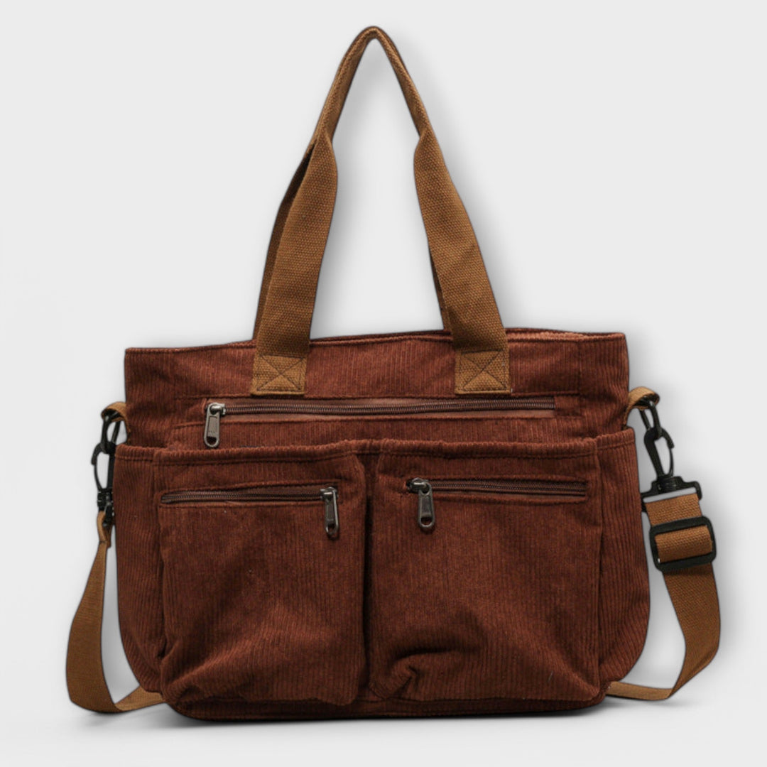 Borsa tote Iris nera, vista frontale, con manici e tracolla, mostrando il design elegante.
