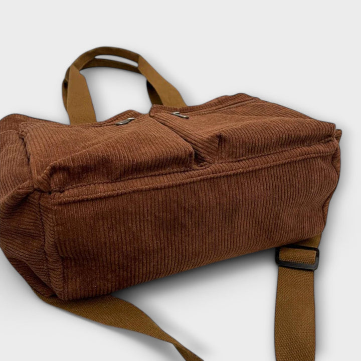 Borsa tote Iris nera, con una sciarpa colorata annodata al manico, per uno stile personalizzato.