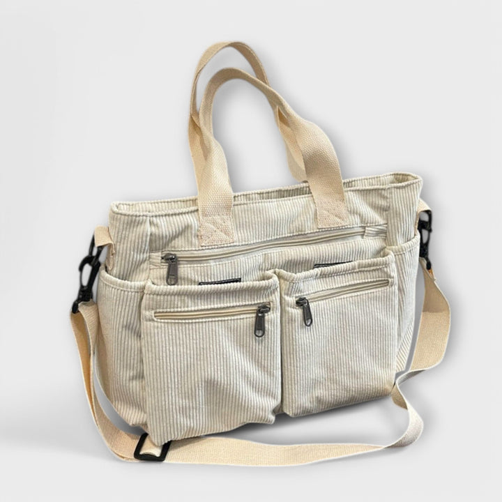 Borsa tote Iris verde, inquadratura ravvicinata del materiale, per apprezzare la texture e la finitura.
