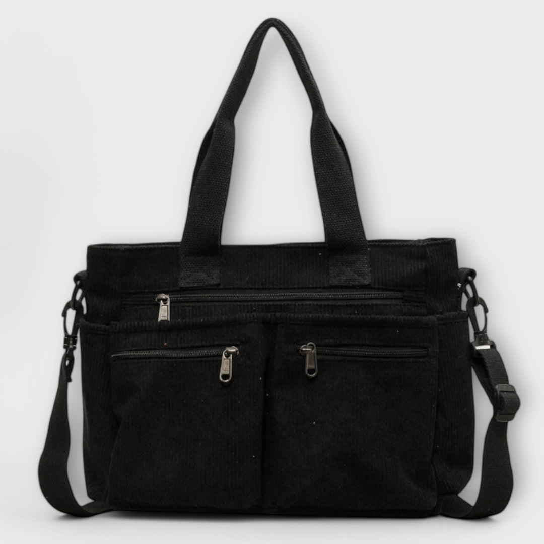Borsa tote Iris marrone, vista posteriore, con dettagli della cucitura e della finitura della pelle.