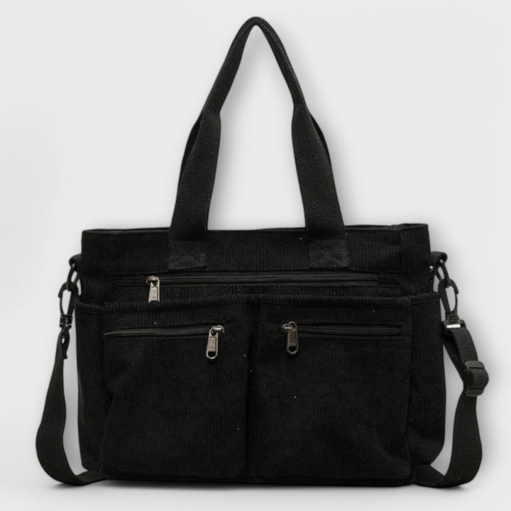 Borsa tote Iris marrone, vista posteriore, con dettagli della cucitura e della finitura della pelle.