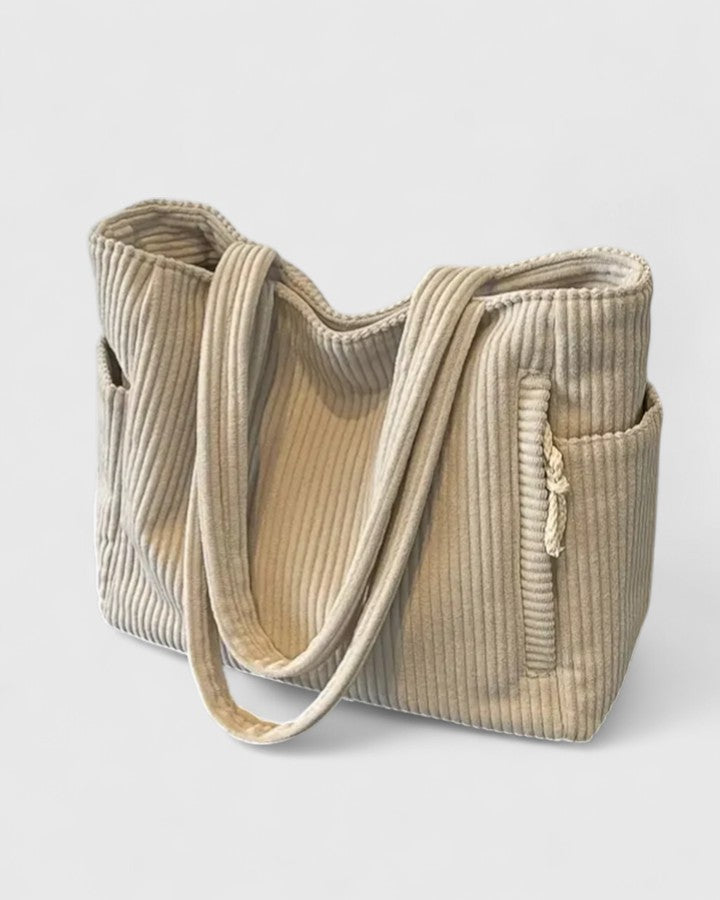 Dettaglio ravvicinato della borsa Isabel bianca, che mostra la texture del design a corda e le cuciture.