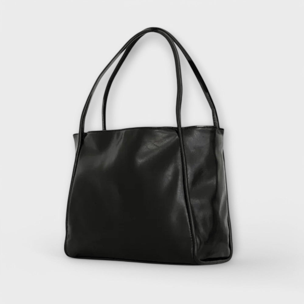 Borsa Isabelle marrone scuro, angolazione leggermente laterale che mostra la texture del materiale.