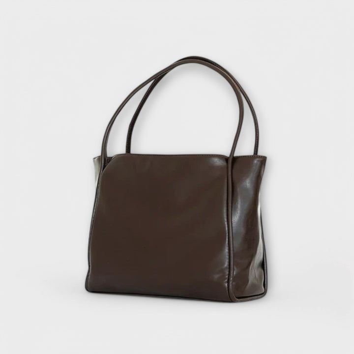 Borsa vintage Isabelle rossa aperta, con una vista chiara della sua ampia capienza interna.