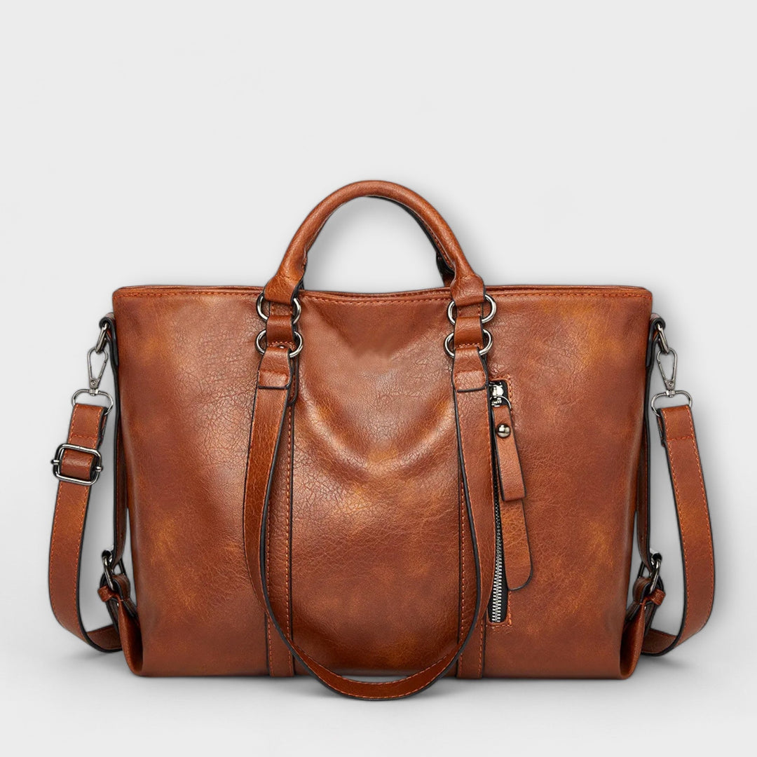 Borsa Liora grande in pelle marrone, vista frontale su sfondo neutro, mostrando la sua eleganza.