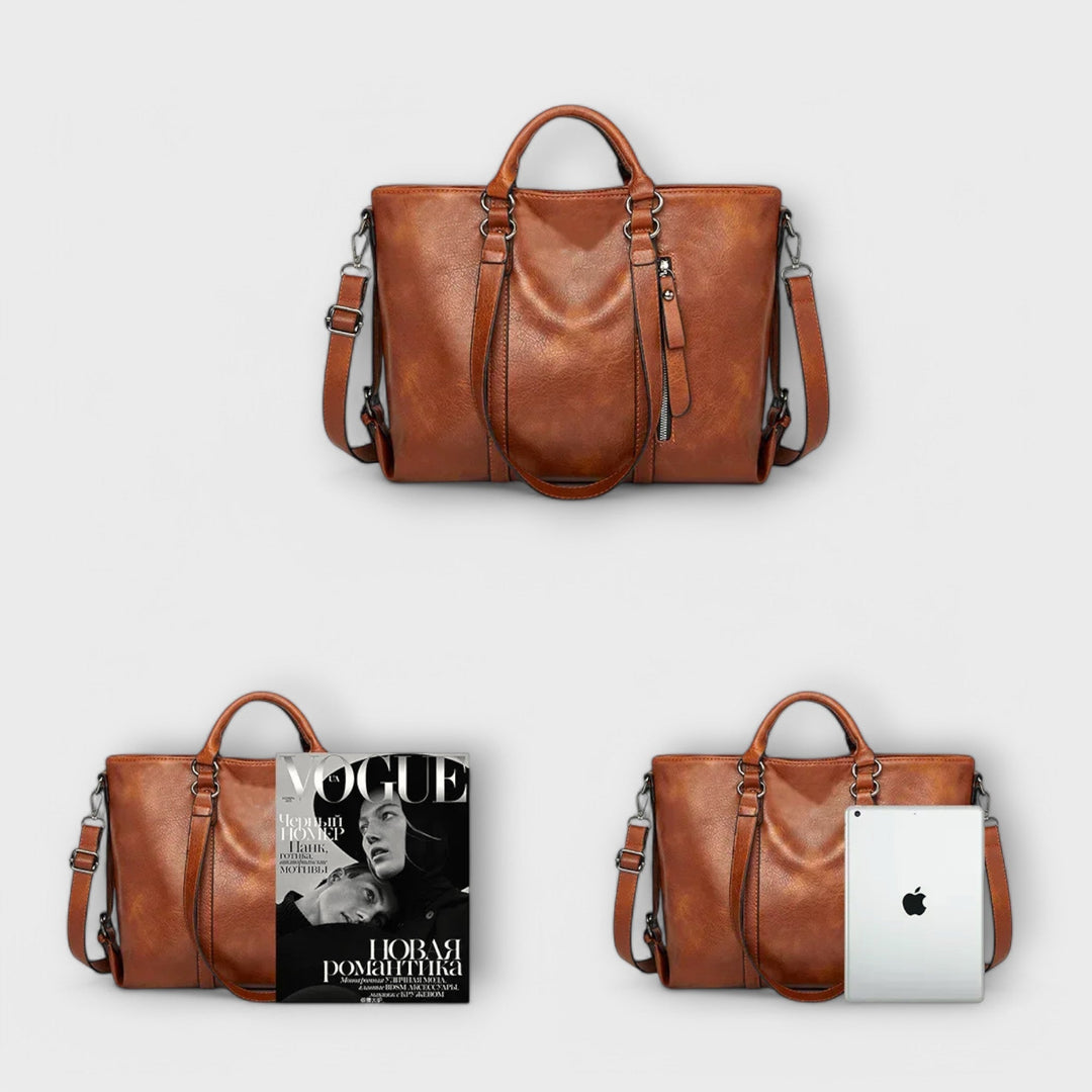 Primo piano dei manici robusti della borsa Liora, con cuciture precise e finiture curate.
