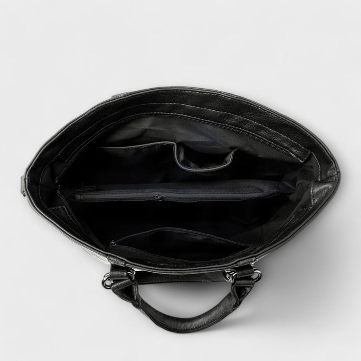 La borsa Liora nera vista lateralmente, mostrando la profondità e la capacità di contenimento.
