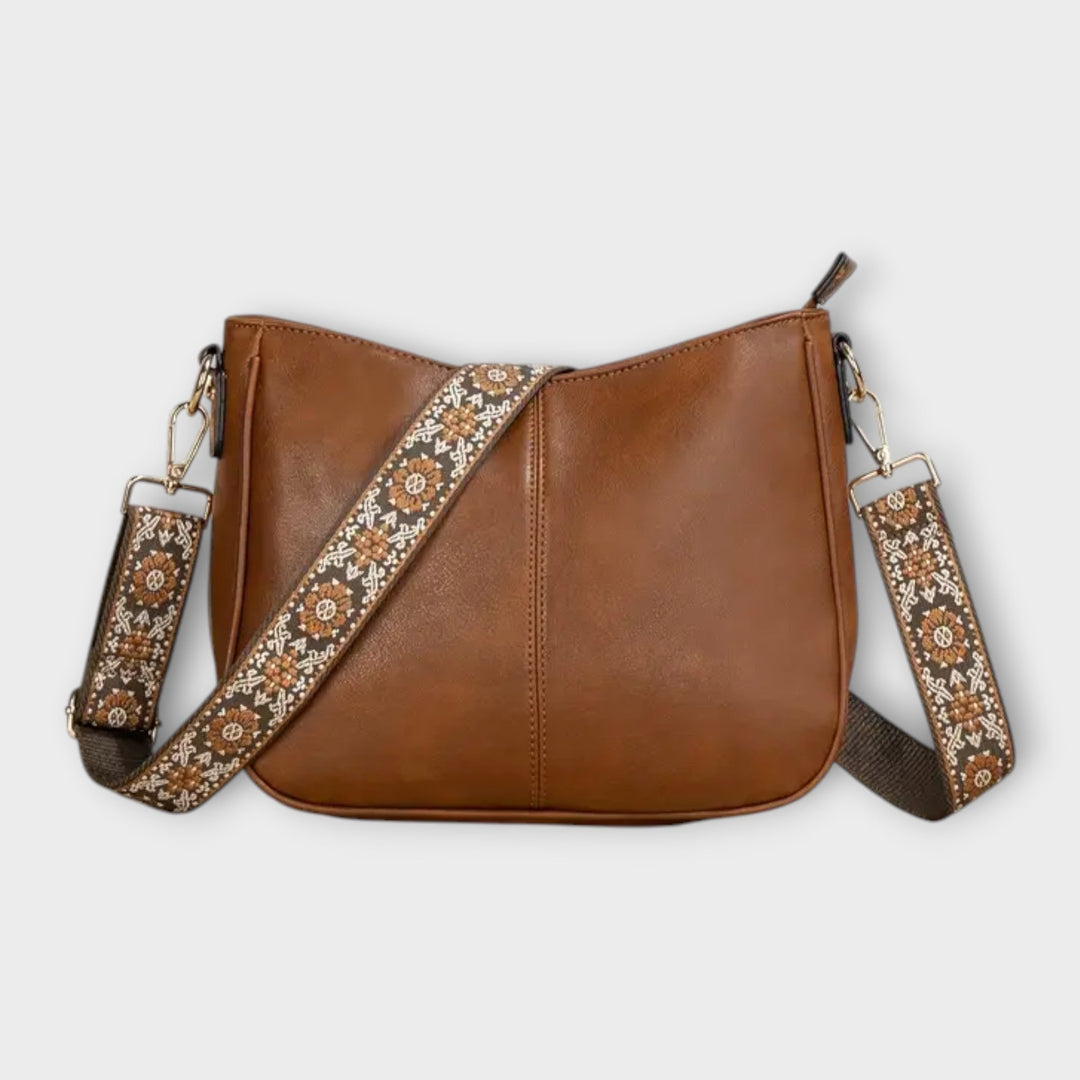 Borsa a tracolla Lola vegana marrone, vista frontale con finiture dorate e tracolla regolata.