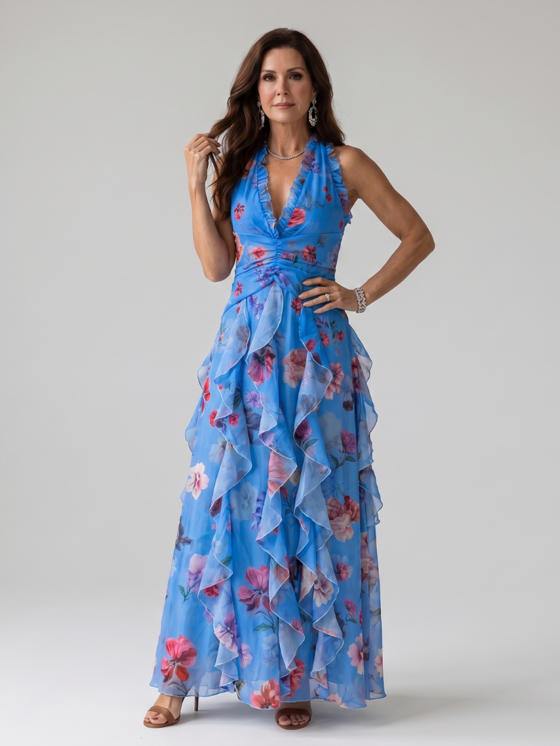 Abito lungo floreale blu con scollo halter, presentato su manichino, vista frontale completa.