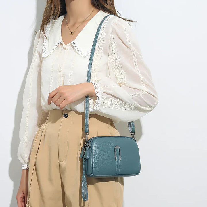 Assortimento di borse a tracolla eleganti Odette nei vari colori disponibili: marrone, verde, blu, kaki e nero.