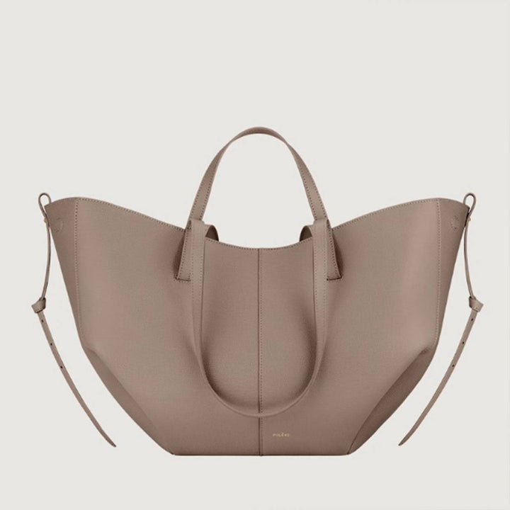 Profilo laterale della borsa tote Sophie, mostrando la sua capienza e la forma strutturata.