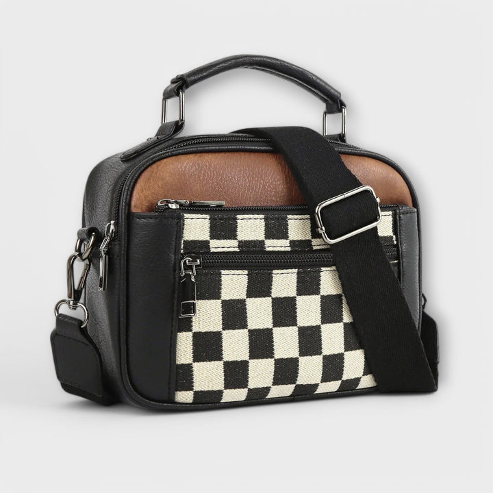 Borsa a spalla Talia nera, vista frontale, con tracolla regolabile e dettagli metallici discreti.